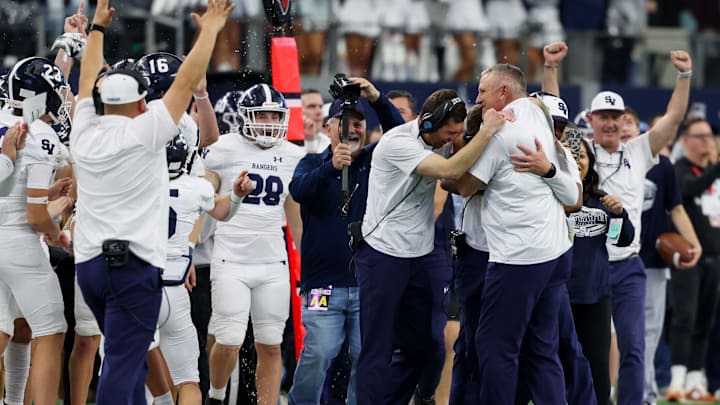 Smithson Valley cocahes celebrate winning the Texas 5A Division 1 state championship game at AT&T Stadium.