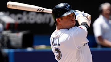 Blue Jays' infielder Aaron Hill takes a hard cut against the Yankees