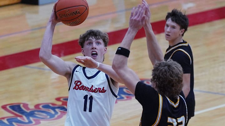 Ballard Bryce Miller (11) shoots the ball over over Winterset forward/guard Jace Bellamy (24) during the third quarter in the high school boys basketball on Jan. 13, 2026, at Ballard High School in Huxley, Iowa.