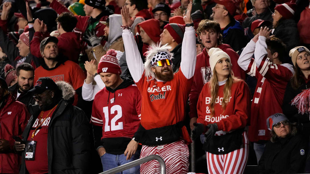 Oct 28, 2023; Madison, Wisconsin, USA; Wisconsin Badgers fans celebrate a touchdown during the second half of the NCAA football game against the Ohio State Buckeyes at Camp Randall Stadium. Ohio State won 24-10.