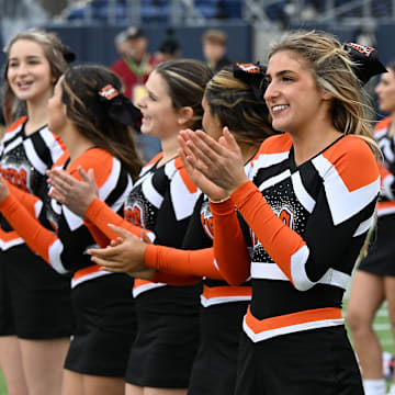 Liberty Center cheerleaders cheer during the 2023 Division V state championship game.