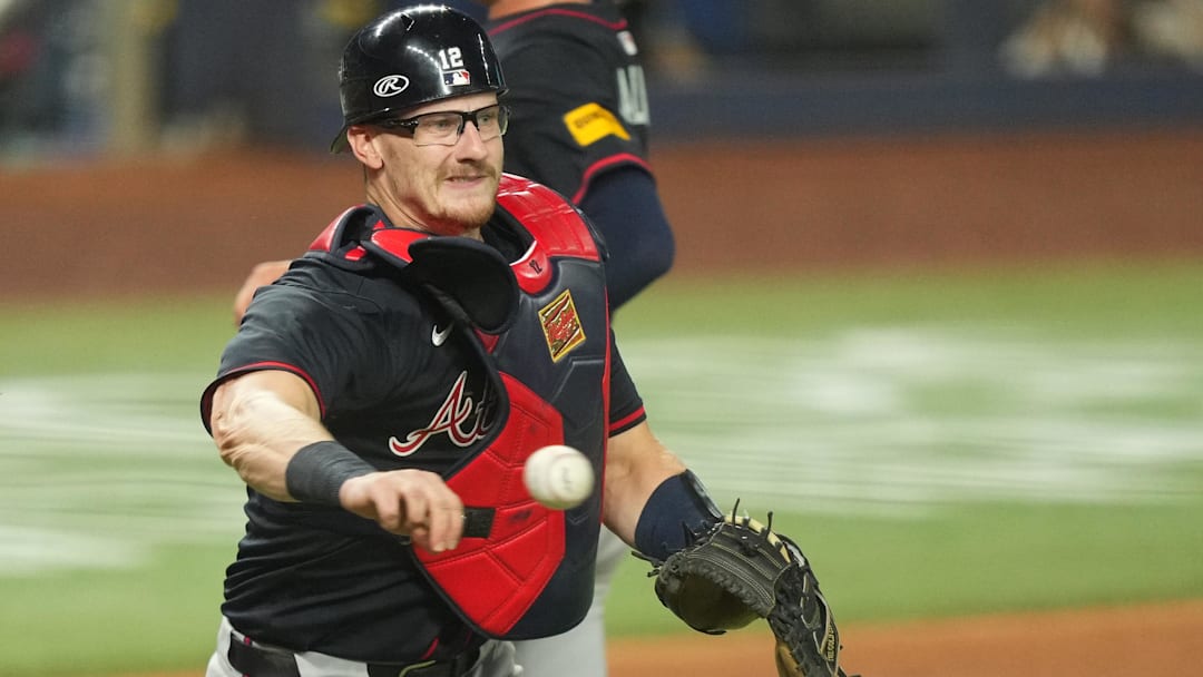 Aug 26, 2025; Miami, Florida, USA; Atlanta Braves catcher Sean Murphy (12) throws out Miami Marlins right fielder Jakob Marsee (87) in the fifth inning at loanDepot Park. Aug 26, 2025; Miami, Florida, USA; Atlanta Braves catcher Sean Murphy (12) throws out Miami Marlins right fielder Jakob Marsee (87) in the fifth inning at loanDepot Park.