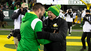 Dan Lanning and Rob Mullens celebrate a win at Autzen Stadium. Judge Claudia Wilkins approved the House Settlement Friday night, a decision that creates new challenges for college sports.