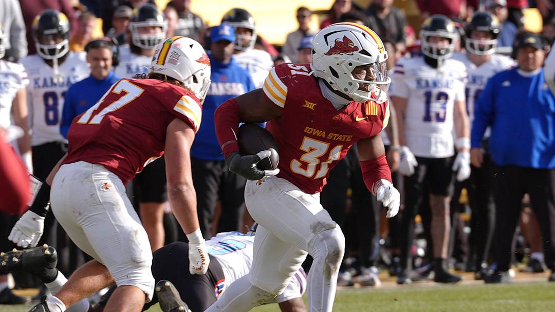 Iowa State Cyclones' defensive back Marcus Neal Jr. runs with the ball after a interception against the Kansas Jayhawks. Iowa State Cyclones' defensive back Marcus Neal Jr. runs with the ball after a interception against the Kansas Jayhawks.