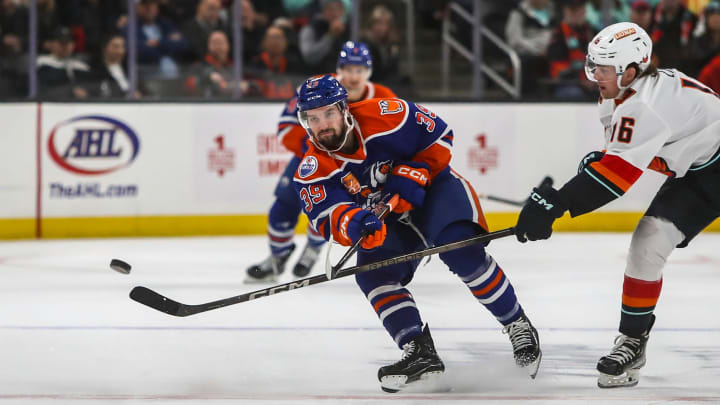 Bakersfield forward Seth Griffith (39) passes the puck down the ice as Coachella Valley forward Kole Lind (16) reaches out to try to block the pass during the first period of their game at Acrisure Arena in Palm Desert, Calif., Saturday, Dec. 16, 2023.