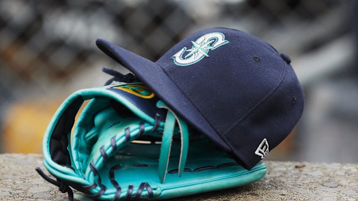 Hat and glove of Seattle Mariners center fielder Dee Gordon (9) sits in dugout during the third inning against the Detroit Tigers at Comerica Park in 2018.