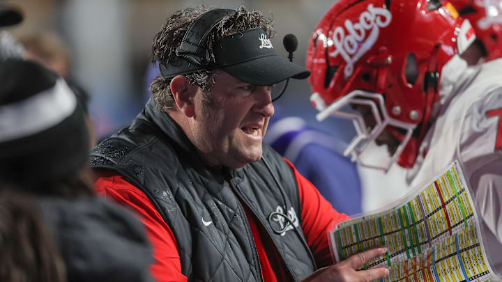Head Coach Jason Eck of the New Mexico Lobos talks to his team during the second half against the Boise State Broncos at Albertsons Stadium on October 11, 2025 in Boise, Idaho. Boise State won the game 41-25.