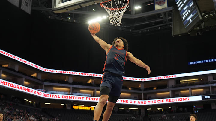 Brayden Burries of Roosevelt soars in for a dunk during the California (CIF) State Open Division title game at the Golden 1 Center in Sacramento.