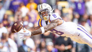 Malik Nabers (8) dives for a ball as the LSU Tigers take on Texas A&M in Tiger Stadium in Baton Rouge, Louisiana, November 25, 2023.