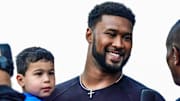 May 25, 2025; Indianapolis, Indiana, USA; Indianapolis Colts player DeForest Buckner and his children walk the red carpet on Sunday, May 25, 2025, ahead of the 109th running of the Indianapolis 500 at Indianapolis Motor Speedway. 