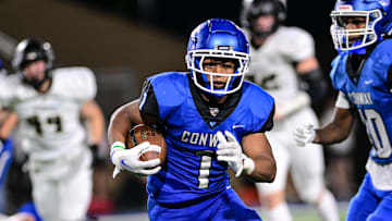 Trey Harris ran for more than 100 yards Friday night in Conway's win over Bentonville.