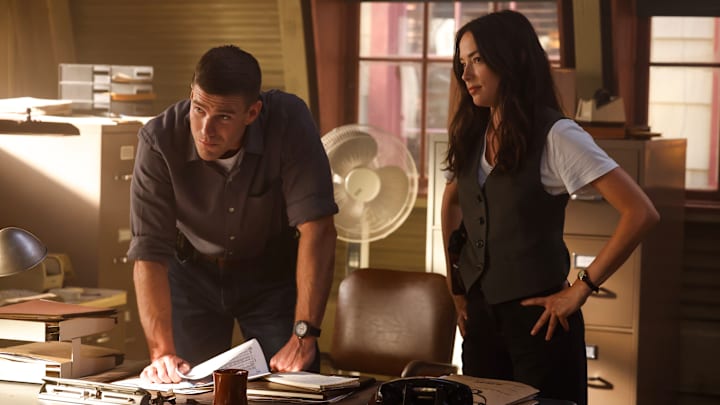 “Enter Sandman” – NCIS: ORIGINS follows a young Leroy Jethro Gibbs (Austin Stowell) in 1991, years prior to the events of NCIS, and is narrated by Mark Harmon. In the series, Gibbs starts his career as a newly minted special agent at the fledgling NCIS Camp Pendleton office, where he forges his place on a gritty ragtag team led by NCIS legend Mike Franks (Kyle Schmid), on the series premiere of NCIS: ORIGINS, Monday, Oct. 14 (9:00-11:00 PM, ET/PT) on the CBS Television Network, and streaming on