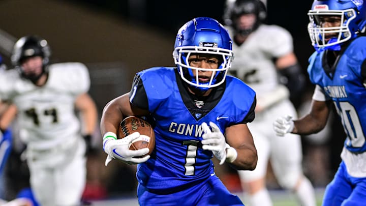 Trey Harris ran for more than 100 yards Friday night in Conway's win over Bentonville.