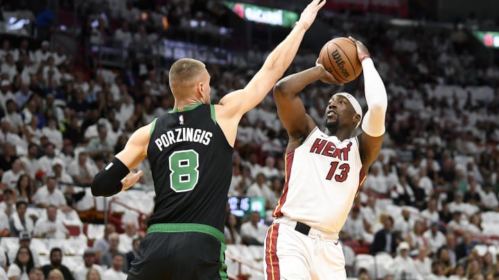 Apr 29, 2024; Miami, Florida, USA; Miami Heat center Bam Adebayo (13) shoots over Boston Celtics; Credit: Michael Laughlin-USA TODAY Sports