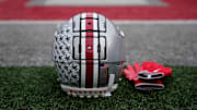 An Ohio State Buckeyes helmet sits on the sideline prior to the NCAA football game against the Indiana Hoosiers at Ohio Stadium in Columbus on Saturday, Nov. 23, 2024.
