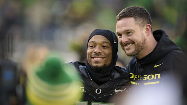 Eugene, Oregon, USA; Oregon Ducks head coach Dan Lanning celebrates with wide receiver Tez Johnson (15) during a senior recog