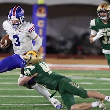 St. Bonaventure's Dylan Dunst tackles Folsom quarterback Ryder Lyons during the fourth quarter of the CIF-State Division 1-A state championship bowl at Saddleback College in Mission Viejo on Saturday, Dec. 9, 2023. St. Bonaventure lost 20-14.