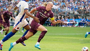 Aug 3, 2024; Columbus, OH, USA; Manchester City forward Erling Haaland (9) gets taken down by Chelsea defender Levi Colwil (6) that results in a penalty kick in the FC Series game at Ohio Stadium.