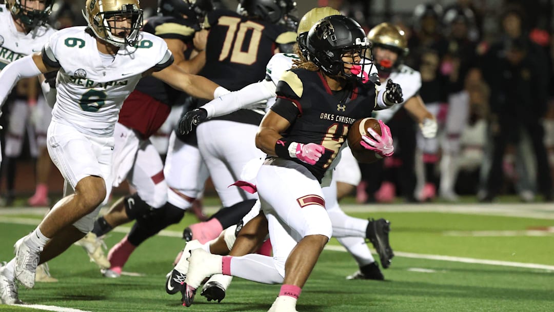Running back Deshonne Redeaux finds an opening during the first quarter of Oaks Christian's 35-0 Marmonte League win over St. Bonaventure Friday night at Redell Field.