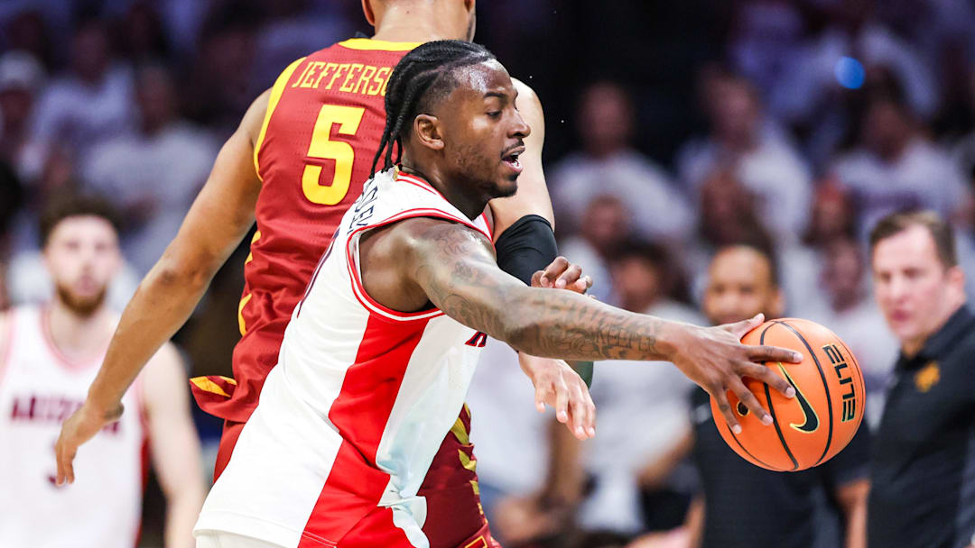 Mar 2, 2026; Tucson, Arizona, USA; Iowa State Cyclones forward Joshua Jefferson (5) fouls Arizona Wildcats guard Jaden Bradley (0) during the first half of the game at McKale Memorial Center. Mandatory Credit: Aryanna Frank-Imagn Images