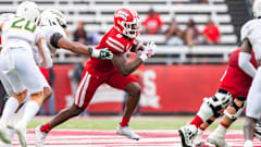 Jacob Kibodi runs the ball as the Louisiana Ragin Cajuns take on Southeastern Louisiana.