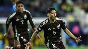 Gerardo Arteaga (right) exults after scoring for El Tri against Jamaica in a Copa América group stage match against Jamaica. Luis Romo (#7) races over to join the celebration.