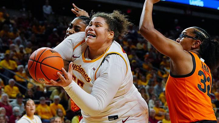 Iowa State Cyclones' center Audi Crooks (55) goes for a shot around Oklahoma State Cowgirls forward Achol Akot (11) and guard Stailee Heard (32) during the first quarter in the senior day women basketball at Hilton Coliseum on February. 25, 2026, in Ames, Iowa.