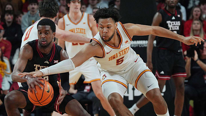 Iowa State Cyclones forward Joshua Jefferson (5) tries to steal the ball from Texas Tech Red Raiders guard Donovan Atwell (12) during the first half in the Big-12 conference men’s basketball against Texas Tech on Feb. 28, 2026, at Hilton Coliseum in Ames, Iowa.