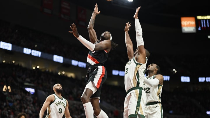 Mar 11, 2024; Portland, Oregon, USA; Portland Trail Blazers forward Jerami Grant (9) scores a basket during the first half against Boston Celtics center Al Horford (42) at Moda Center. Mandatory Credit: Troy Wayrynen-USA TODAY Sports