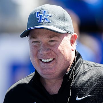 Kentucky head coach Mark Stoops smiled while walking onto the field before the Kentucky Wildcats' Blue White scrimmage at Kroger Field on Saturday afternoon in Lexington, Kentucky. April 13, 2024