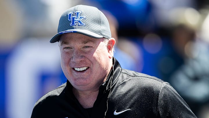 Kentucky head coach Mark Stoops smiled while walking onto the field before the Kentucky Wildcats' Blue White scrimmage at Kroger Field on Saturday afternoon in Lexington, Kentucky. April 13, 2024