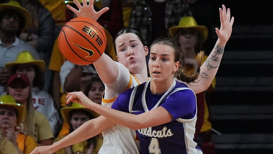 Iowa State Cyclones' forward Addy Brown (24) defends as Kansas State Wildcats guard Serena Sundell (4) passes the ball during the fourth quarter in the Big-12 women’s basketball at Hilton Coliseum on Sunday, March 2, 2025, in Ames, Iowa.