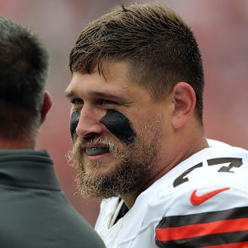 Cleveland Browns guard Wyatt Teller (77) chats with senior consultant Mike Vrabel on the sideline during the first half of an NFL preseason football game at Cleveland Browns Stadium, Saturday, Aug. 10, 2024, in Cleveland, Ohio.