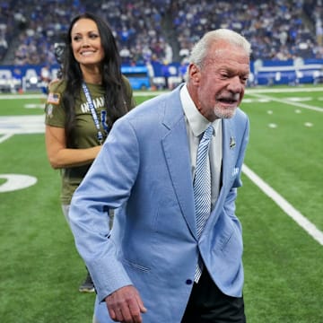 Jim Irsay, Colts team owner, walks to a waiting golf cart with his girlfriend Michelle Paul, on Sunday, Oct. 1, 2023, during a halftime event during the team s 29-23 loss to the Los Angeles Rams at Lucas Oil Stadium in Indianapolis.
