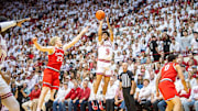 Indiana's Kanaan Carlyle (9) shoots past Ohio State's Colin White (20) during the Indiana versus Ohio State men's basketball game at Simon Skjodt Assembly Hall on Saturday, March 8, 2025.