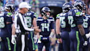 Nov 9, 2025; Seattle, Washington, USA; Seattle Seahawks quarterback Sam Darnold (14) looks on during the second quarter against the Arizona Cardinals at Lumen Field.