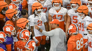 Clemson head coach Dabo Swinney talks with players during the first football practice at the Allen N. Reeves Football Complex at Clemson University in Clemson, S.C. Friday, February 28, 2025.