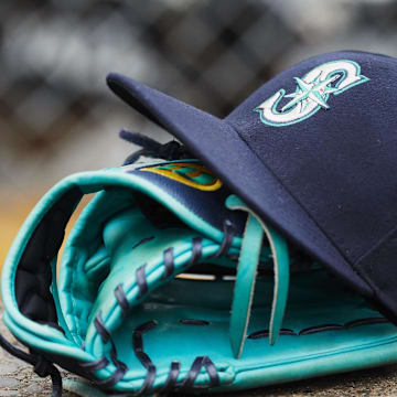 May 12, 2018; Detroit, MI, USA; Hat and glove of Seattle Mariners center fielder Dee Gordon (9) sits in dugout during the third inning against the Detroit Tigers at Comerica Park. Mandatory Credit: Rick Osentoski-Imagn Images