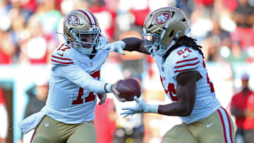 San Francisco 49ers quarterback Brandon Allen (L) and running back Jordan Mason (R)