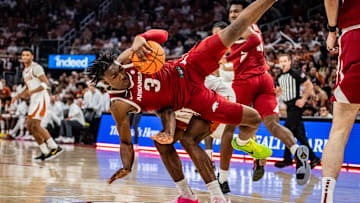 Arkansas Razorbacks forward Adou Thiero (3) tumbles over Texas Longhorns forward Ze'Rik Onyema (21) after catching the rebound in the first half as the Longhorns take on the Razorbacks at the Moody Center, Feb. 5, 2025.