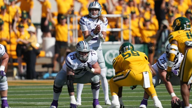 ansas State Wildcats quarterback Avery Johnson (2) stands in shotgun