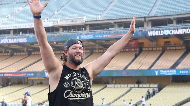 Dodgers pitcher Clayton Kershaw waves to the crowd during the 2025 World Series championship celebration at Dodger Stadium in Los Angeles on Monday, Nov. 3, 2025.