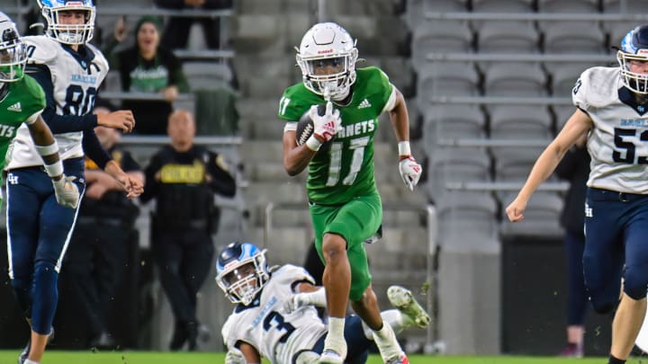 Lincoln's Isaiah Grant sprints away from defenders in last season's Open Division championship game