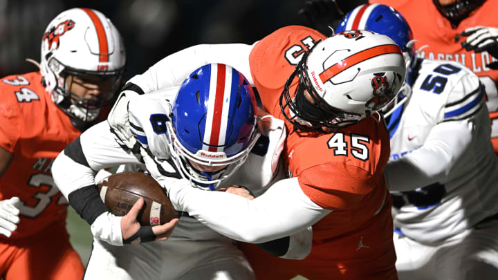 Michael Wright, Jr. of Massillon makes a tackle against Lake in a regional final in November, 2022. 