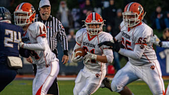 Byron's Jared Claunch (No. 65) blocks in the Class 3A state semifinal game in Nov. 2021.