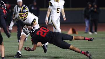 Ventura's Tristan Phillips is tackled by Rio Mesa's Juan Munoz during the third quarter of the teams' CIF-SS Division 5 first-round game at Royal High on Friday, Nov. 8, 2024. Rio Mesa won, 21-18.