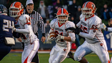 Byron's Jared Claunch (No. 65) blocks in the Class 3A state semifinal game in Nov. 2021.