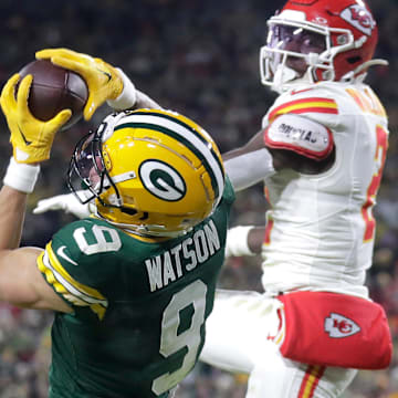 Green Bay Packers wide receiver Christian Watson (9) catches a touchdown pass in front of Kansas City Chiefs cornerback Joshua Williams on Dec. 3 at Lambeau Field.