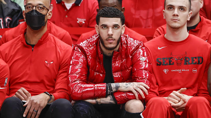 Apr 22, 2022; Chicago, Illinois, USA; Chicago Bulls guard Lonzo Ball (center) looks on from the bench during the second half of game three of the first round for the 2022 NBA playoffs against the Milwaukee Bucks at United Center. Mandatory Credit: Kamil Krzaczynski-Imagn Images