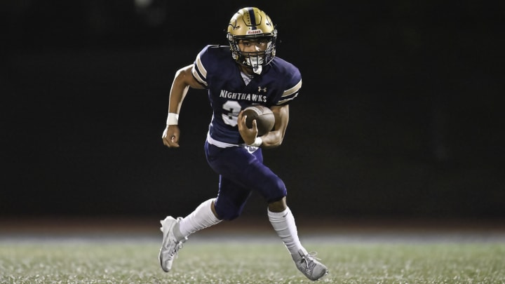 Del Norte's Ryan Remigio carries the ball during the 2023 regular season finale against San Marcos